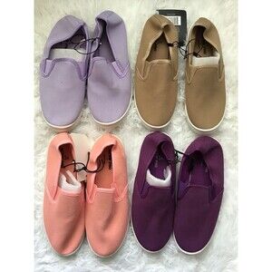 4 Pairs of girls slip on sneakers. Size Large. New with tags